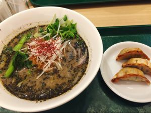 black sesame ramen with veggie dumplings  at T's Tantan - Tokyo JR Station in Tokyo