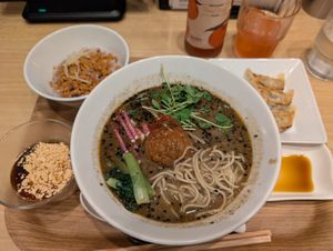 Black sesame ramen set with pan fried gyoza, rice bowl and some kind of yogurt dessert at T's Tantan - Tokyo JR Station in Tokyo