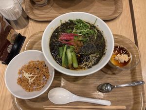 Black sesame ramen with rice and yoghurt sides  at T's Tantan - Tokyo JR Station in Tokyo