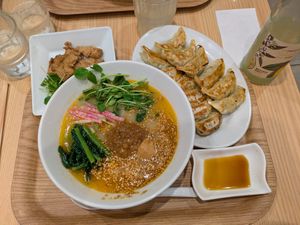 Golden sesame ramen with gyozas and soy meat plus a lemon drink at T's Tantan - Tokyo JR Station in Tokyo