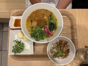 Vegan Golden Sesame Tantanmen with vegan cheese and the soy-meat wirh rice bowl side  at T's Tantan - Tokyo JR Station in Tokyo