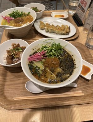 Black sesame Ramen, Soy meat on rice, Gyozas, Golden Sesame Ramen  at T's Tantan - Tokyo JR Station in Tokyo