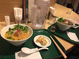 Left - White sesame ramen & dumplings, Right - Black sesame ramen  at T's Tantan - Tokyo JR Station in Tokyo