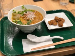 Golden sesame ramen and fried soy meat at T's Tantan - Tokyo JR Station in Tokyo