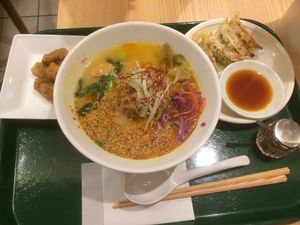 Golden seasame ramen with soy meat and dumplings  at T's Tantan - Tokyo JR Station in Tokyo