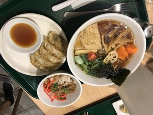 Soy sauce ramen, soy bean meat rice bowl and gyoza at T's Tantan - Tokyo JR Station in Tokyo