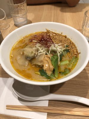 Ramen with peanut butter + sesame seeds + veggies + spicy. Not gluten free. at T's Tantan - Tokyo JR Station in Tokyo