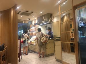 Counter with takeaway cup noodles and stock etc at T's Tantan - Tokyo JR Station in Tokyo