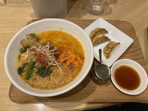Golden sesame ramen with gyoza  at T's Tantan - Tokyo JR Station in Tokyo