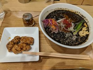 Black sesame ramen with karaage at T's Tantan - Tokyo JR Station in Tokyo