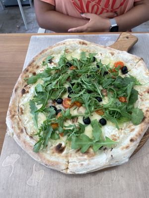 Chef vegan pizza with rocket, olives and mushrooms  at La Bufalina Ibiza in Ibiza