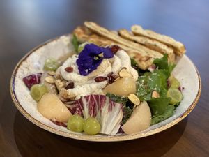 Tofu ricotta cheese salad with crispy toasted flat bread. Pickled peach is fresh   at Lazy Farmers in Seoul