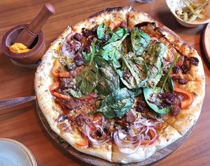 Veggie ball pizza, served with sauce at Lazy Farmers in Seoul