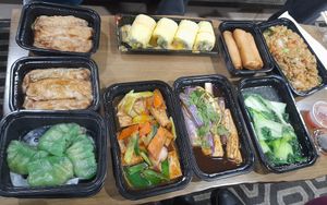 Clockwise from top left: Bean Curd Rolls, Mango Lover Rolls, Veggie Spring Rolls, Veggie Fried Rice, Yau Choy, Eggplant, Tofu Stir Fry, and Mushroom Dumplings at Red Ginger Dimsum & Tapas in Asheville