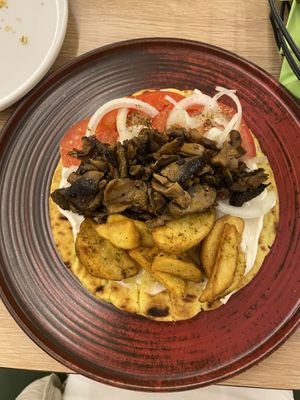 The restaurant has two seperate menus and the vegan one is called veganissimo. Love the souvlaki, tzatziki sauce is good. Great service. Also got free vegan yogurt after meal.  at Veganissimo in Santorini