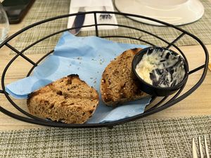 Bread with tzatziki given without having ordered and then charged for!?!?  at Veganissimo in Santorini