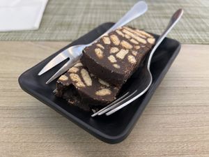 Complimentary chocolate biscuit orange dessert  at Veganissimo in Santorini