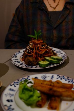 Fried noodles and fried spring rolls at Thong Dong Vegan Kitchen & Cafe in Lao Cai