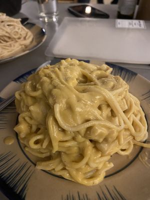 Pumpkin pasta and creamy pasta behind.  at Thong Dong Vegan Kitchen & Cafe in Lao Cai