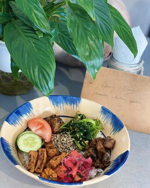 mixing rice at Thong Dong Vegan Kitchen & Cafe in Lao Cai