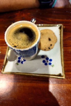 Vietnamese coffee with 🍪 at Thong Dong Vegan Kitchen & Cafe in Lao Cai