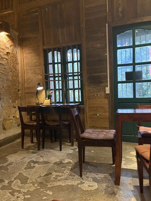 Downstairs + lots of cats  at Thong Dong Vegan Kitchen & Cafe in Lao Cai