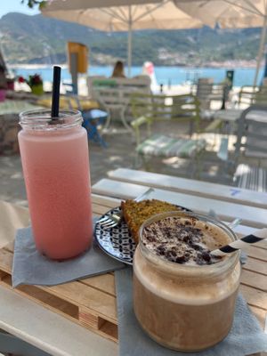 Banana Frozen Cappicino (requested oat milk) was so delicious and creamy. Tasted like a milkshake!

Wasn’t keen on poppy cake at first but was so nice we ordered another slice! at Juices & Books in Skopelos