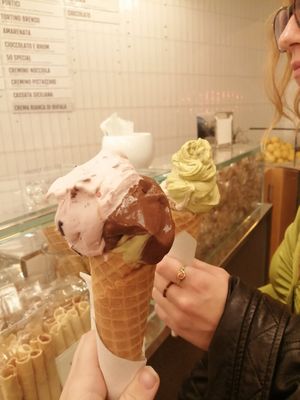 Sour cherry, chocolate and pistachio at the front and pistachio (€4) and almond at the back (€3). at Cremeria Cavour in Bologna