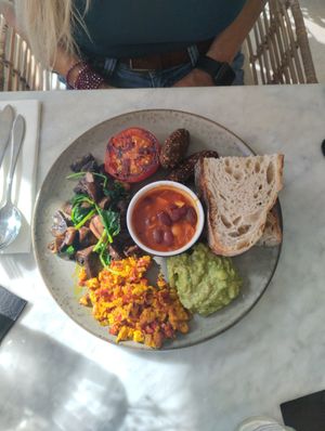 Vegan English Breakfast (Scramble Tofu, Sauté Mushrooms and Spinach 🥬, Beans, Falafel 🧆, Avocado 🥑, Tomato 🍅 and Sourdough Bread 🍞) at The Skinny Kitchen - Eivissa in Ibiza