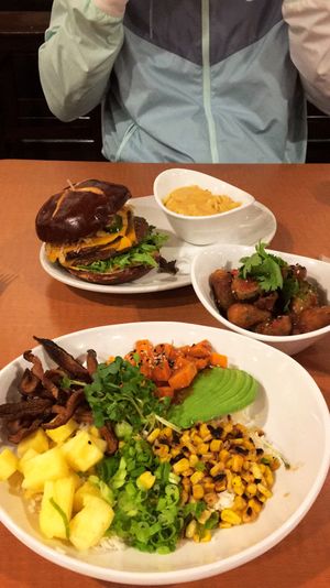 Buddha bowl, Thai chili Brussels sprouts, & Peri Peri chicken sandwich   at Native Foods in Encinitas