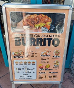 Sign outside at Qué Pasa - Downtown in Kyoto