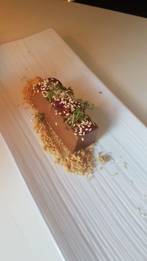 Dessert, chocolate mousse with toasted cookie crumble, raspberry coulis - part of five course set menu at Gro in Oerebro