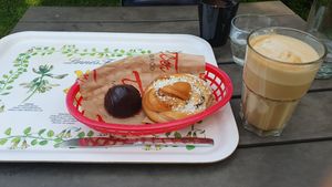 Vegan chocolate cream cookie and cardamom bun, latte with oat milk at Cafe Victoria in Uppsala