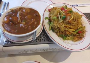 Veggie curry and veganised Singapore noodles. at Phoenix Cantonese in Lincoln