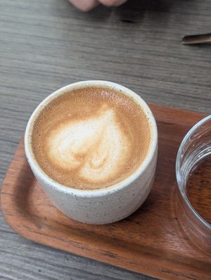 Coffee served with water at Caleta Dolsa Coffee in Lima