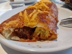 Inside of a Sausage, Egg, and Cheese Roll at Flour + Time Bakery in Atlanta