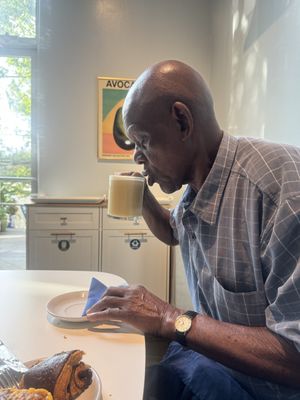 My sweet father in-law with a wonderful lavender mint oat milk herbal tea.   at Flour + Time Bakery in Atlanta