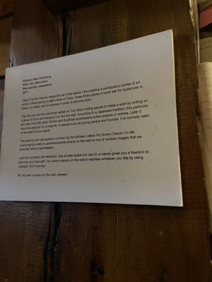 Explaining the art  at Friends Ramen in Chicago