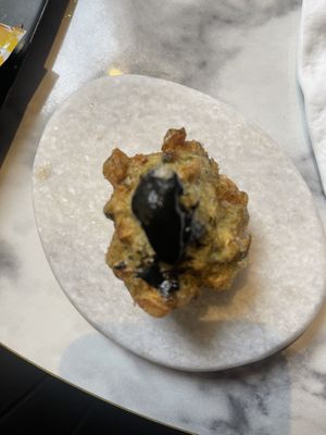 Amuse-bouche made with black garlic instead of honey!   at Cucù in Vicenza