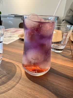 Sakura-themed sweet drink with “butterfly pea” ice cubes   at MERCY Vegan Factory in Osaka