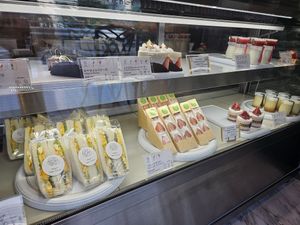 Display cabinet with pastries available for purchase at MERCY Vegan Factory in Osaka