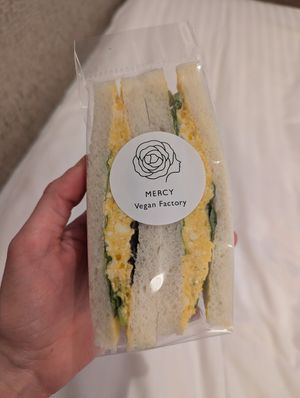 a takeaway portion of the egg sandwich, pictured in the hotel at MERCY Vegan Factory in Osaka