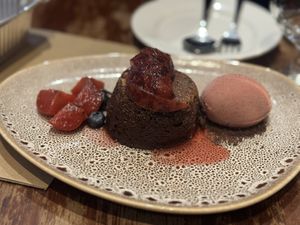 Chocolate cake dessert with raspberry ice cream  at David Bann Restaurant in Edinburgh