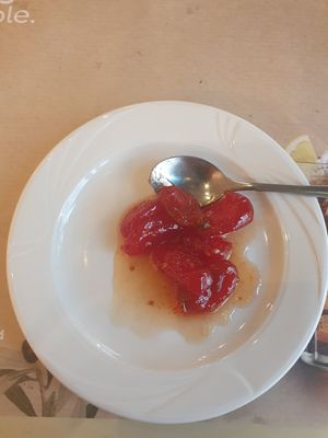 Complimentary dessert, tomatoes in sugar at Agrimia Restaurant in Crete