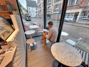 Inside, stools and small tables at Bodhi in Leuven