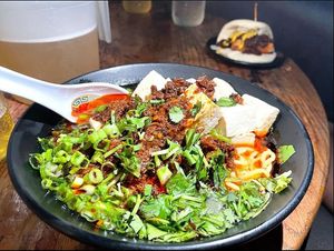 Spicy Mapo Ramen (Vegan)
Shiitake mushroom, fermented black bean, sichuan pepper, tofu, cilantro, scallions at Ruckus Ramen in Lansing