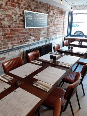 Nice and open, love the exposed brick, there are green velvet chairs at the BACK to avoid leather chairs....(you can request the back tables) at The Steakist in Arundel