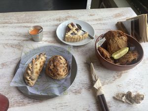 Tofu empanada, vegan bacon empanada, tart, and fried tofu   at Coma Veggie in Buenos Aires