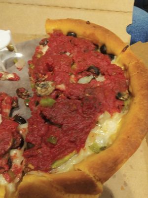 Our half eaten veggie deep dish at Gino's East - South Loop in Chicago