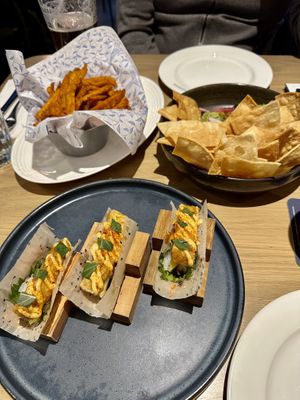 Sweet potato fries, guacamole dip and tofu taco sushi  at Earls Kitchen + Bar in Toronto